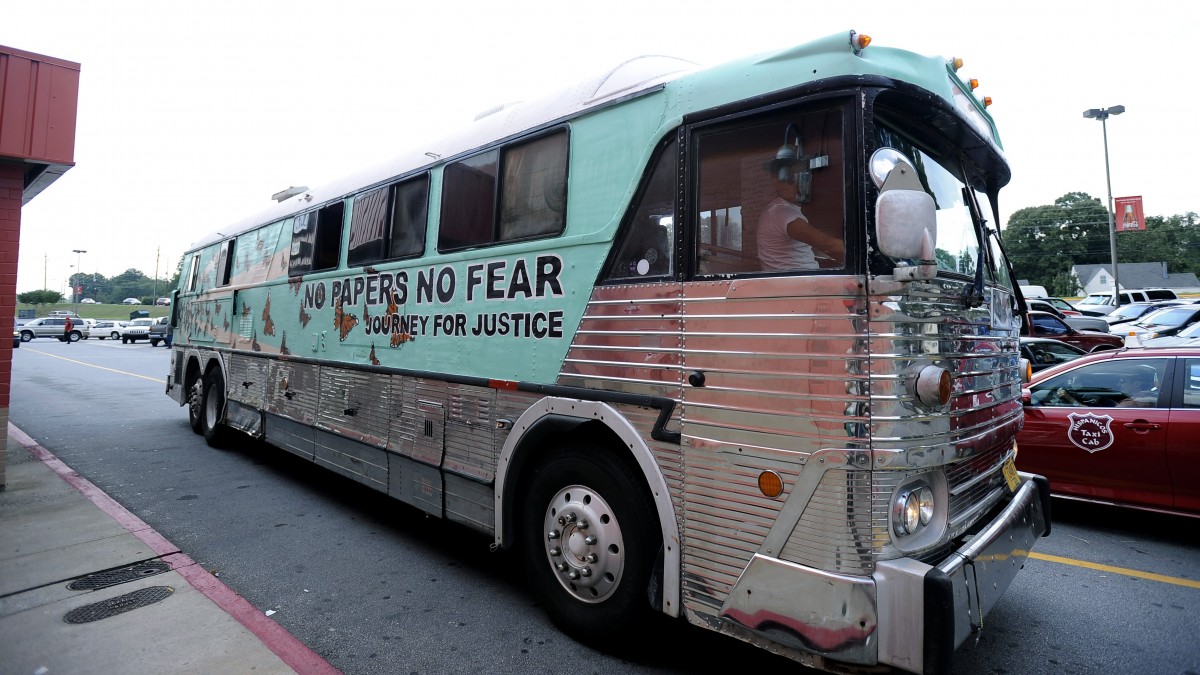 Members of a cross country group of undocumented immigrants arrive by motor coach to participate in a "No Papers No Fear" event at Fiesta Mall, a gathering spot for the city's growing Hispanic community, Saturday Aug. 25, 2012, in Atlanta. (AP Photo/David Tulis)