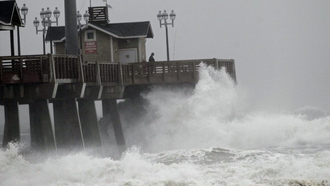 Large waves generated by Hurricane Sandy crash into Jeanette's Pier in Nags Head, N.C., Saturday, Oct. 27, 2012 as the storm moved up the east coast. (AP Photo/Gerry Broome)