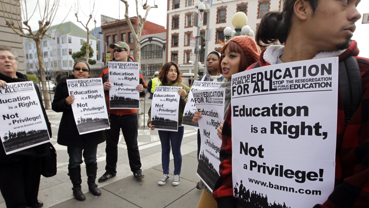 In this Feb. 13, 2012, file photo, demonstrators protest outside of the U.S. 9th Circuit Court of Appeals after a panel heard oral arguments in San Francisco in a lawsuit seeking to overturn Proposition 209, which barred racial, ethnic or gender preferences in public education, employment and contracting. (AP Photo/Paul Sakuma, File)