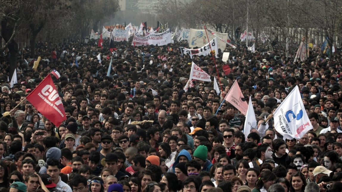 In this Aug. 28, 2012 photo, protesters march to demand education reform in Santiago, Chile. After more than a year of mass protests over education and environmental policies that mobilized millions of people but left many activists feeling frustrated and ignored by the political establishment, municipal elections on Oct. 28, 2012 provides a chance for 5.3 million new voters, more than half of whom are under 30, to be heard. (AP Photo/Luis Hidalgo, File)