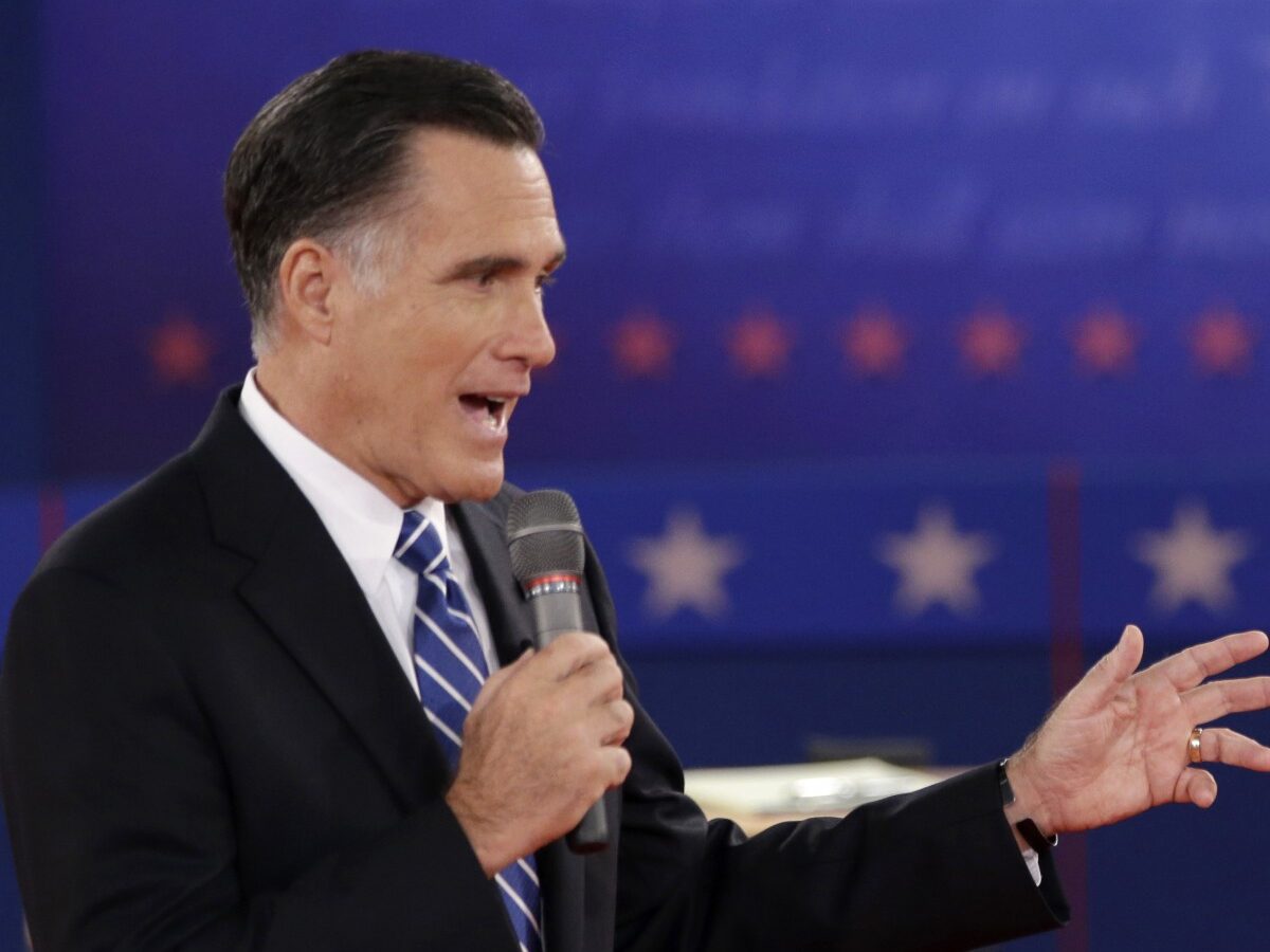 In this Oct. 16, 2012 file photo, President Barack Obama and Republican presidential candidate, former Massachusetts Gov. Mitt Romney exchange views during the second presidential debate at Hofstra University in Hempstead, N.Y. (AP Photo/David Goldman, File)