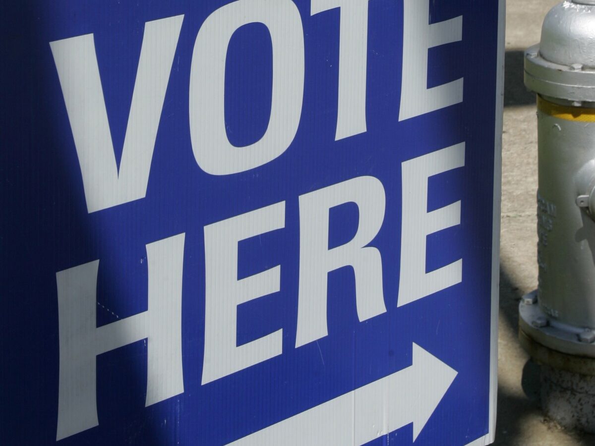 This May 3, 2010 file photo shows a "vote here" sign near a polling place open for early voting in downtown Little Rock, Ark. (AP Photo/Danny Johnston, File)