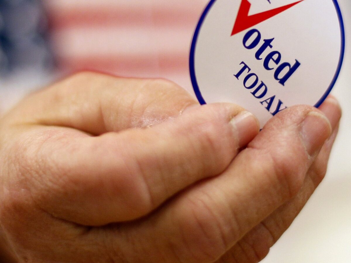 This Nov. 2, 2010 file photo shows a sticker handed out to a voter on Election Day, in Waterville, Maine. (AP Photo/Robert F. Bukaty, File)