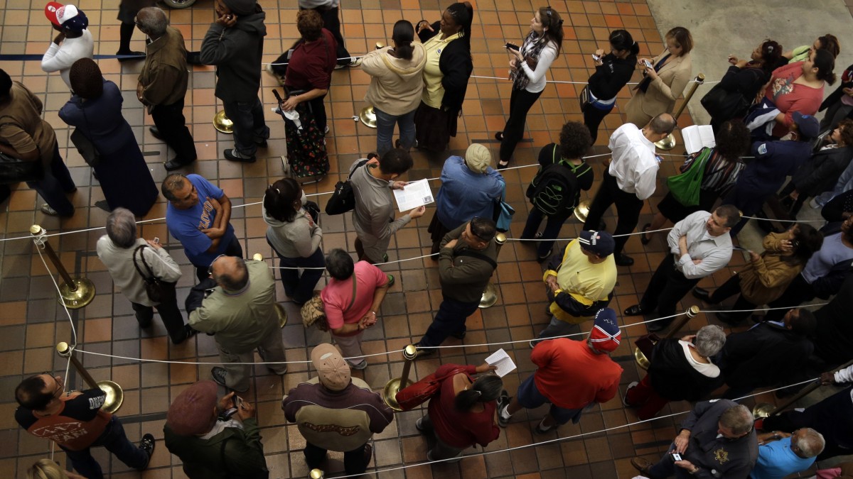 People stand in line to vote during early voting for the presidential election, Monday, Oct. 29, 2012, in Miami. (AP Photo/Lynne Sladky)