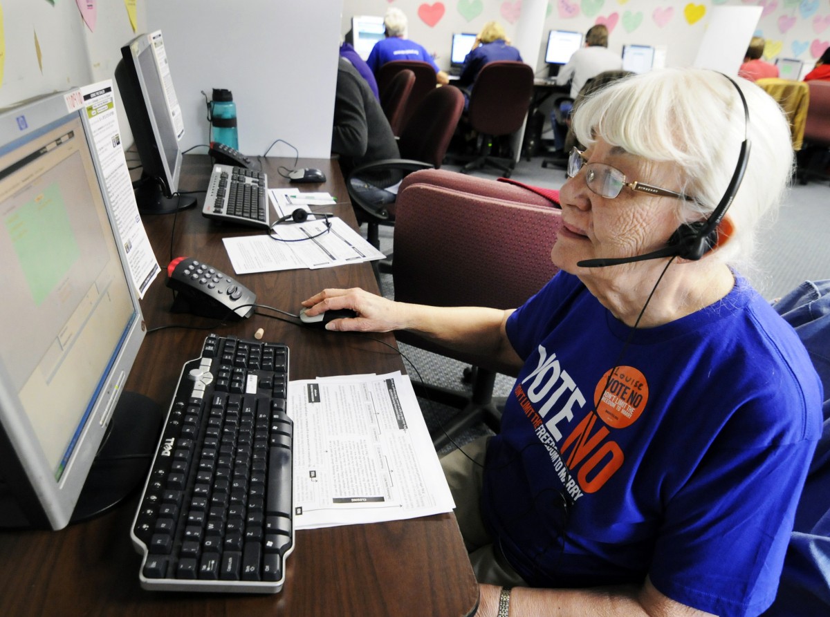 In this Oct. 23, 2012, photo, Louise Pardee calls fellow senior citizens from a Shoreview, Minn, phone bank to urge them to vote against a proposed constitutional ban on gay marriage on Minnesota's statewide ballot. (AP Photo/Jim Mone)