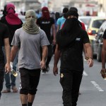 Masked Bahraini anti-government protesters carry petrol bombs ahead of a march in Malkiya, Bahrain, on Sunday, Oct. 28, 2012, where marchers were calling for freedom for political prisoners and honoring those killed in the uprising from Bahrain's western villages. (AP Photo/Hasan Jamali)