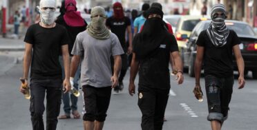 Masked Bahraini anti-government protesters carry petrol bombs ahead of a march in Malkiya, Bahrain, on Sunday, Oct. 28, 2012, where marchers were calling for freedom for political prisoners and honoring those killed in the uprising from Bahrain's western villages. (AP Photo/Hasan Jamali)