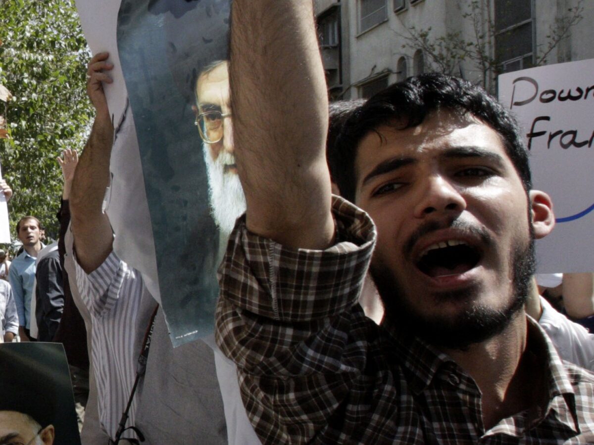 Holding posters of Iranian supreme leader Ayatollah Ali Khamenei, demonstrators chant slogans in front of the French Embassy in Tehran, Iran, Thursday, Sept. 20, 2012, during a protest the publication of caricatures of Islam's Prophet Muhammad by a French satirical weekly. (AP Photo/Vahid Salemi)