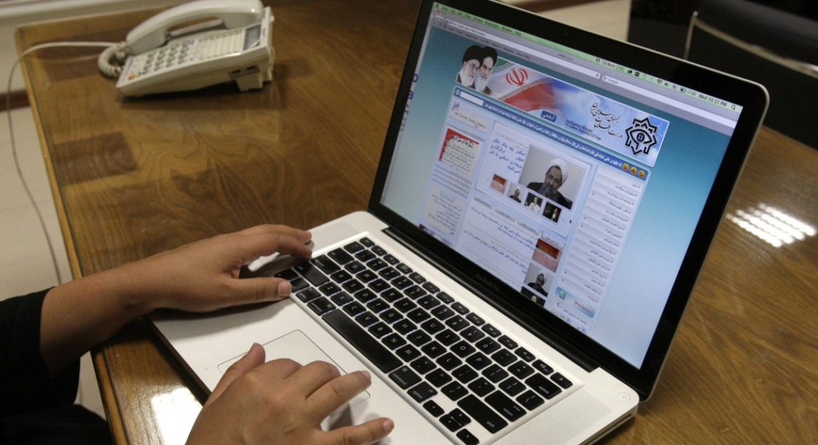 Iranian photojournalist Maryam Rahmanian uses her computer to check a newly launched website Wednesday, Oct. 10, 2012. (AP Photo/Vahid Salemi)
