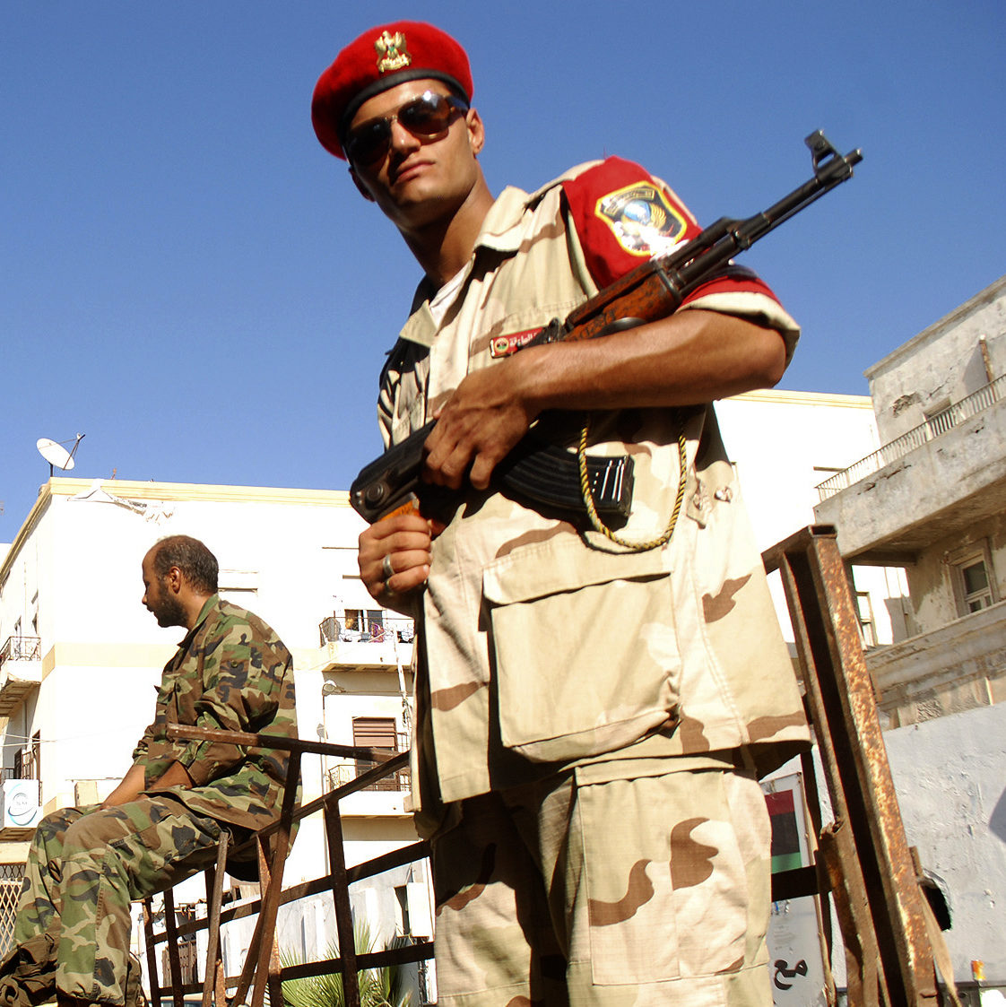Libyan security forces stand guard as people turn in weapons in Benghazi, Libya, Saturday, Sept. 29, 2012. (AP Photo/Ibrahim Alaguri)