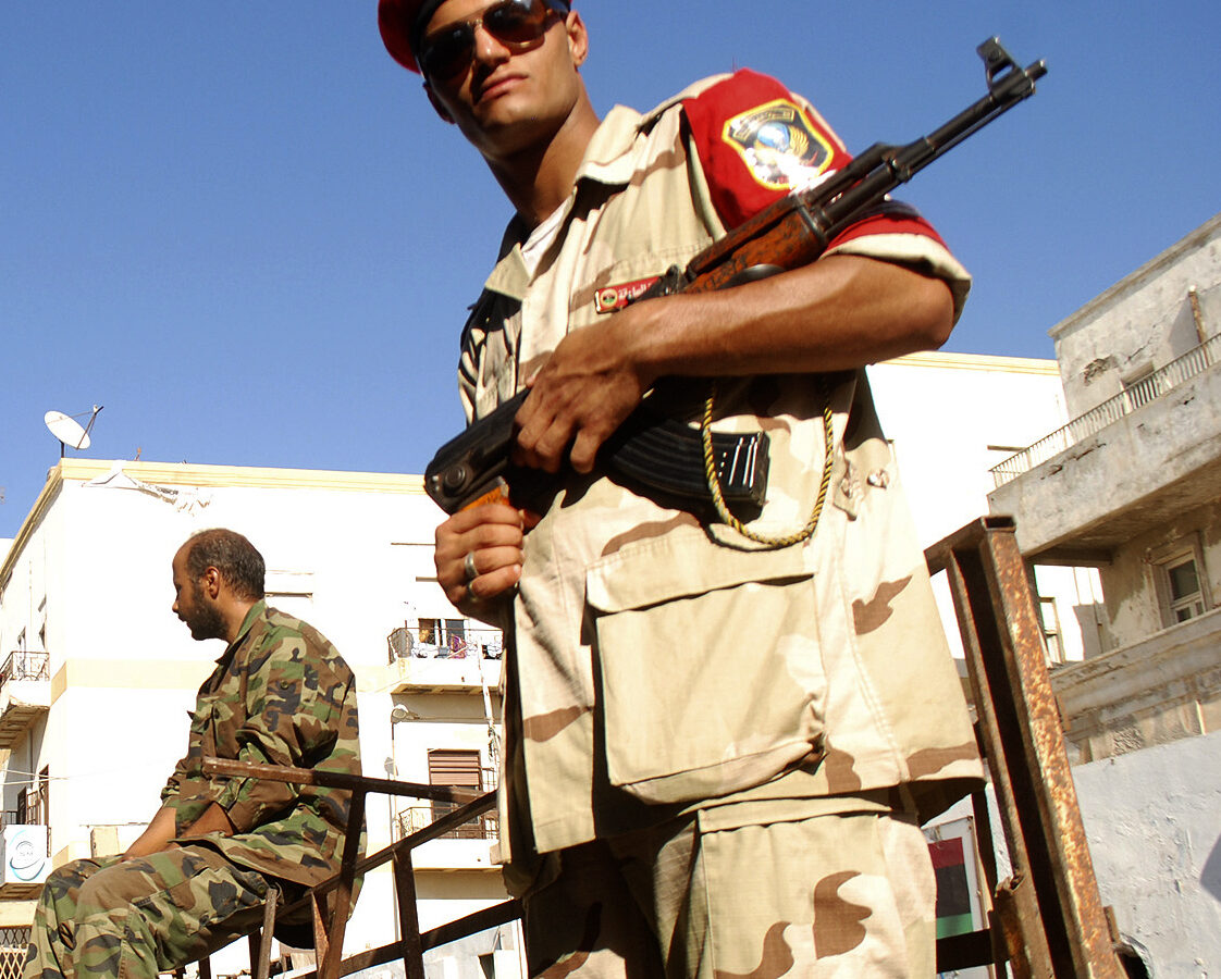Libyan security forces stand guard as people turn in weapons in Benghazi, Libya, Saturday, Sept. 29, 2012. (AP Photo/Ibrahim Alaguri)