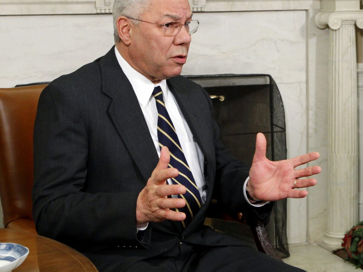 In this Dec. 1, 2010 file photo, former Secretary of State Colin Powell meets with President Barack Obama, in the Oval Office at the White in Washington. (AP Photo/J. Scott Applewhite, File)