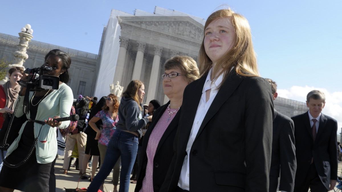 Abigail Fisher, right, who sued the University of Texas, walks outside the Supreme Court in Washington, Wednesday, Oct. 10, 2012. (AP Photo/Susan Walsh)