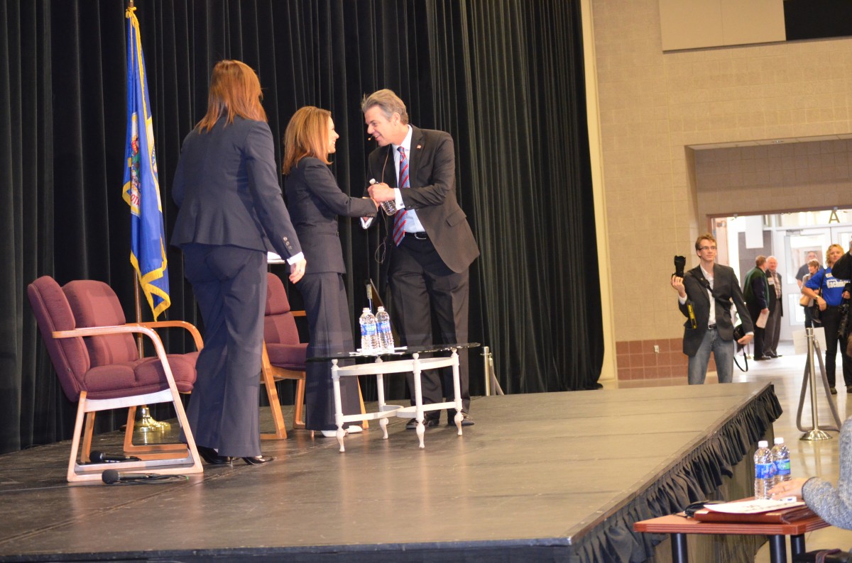 Minnesota Republican Congresswoman Michele Bachmann greets Democratic challenger Jim Graves before a heated debate Tuesday, Oct. 20, 2012. (Photo by Trisha Marczak/MintPress)