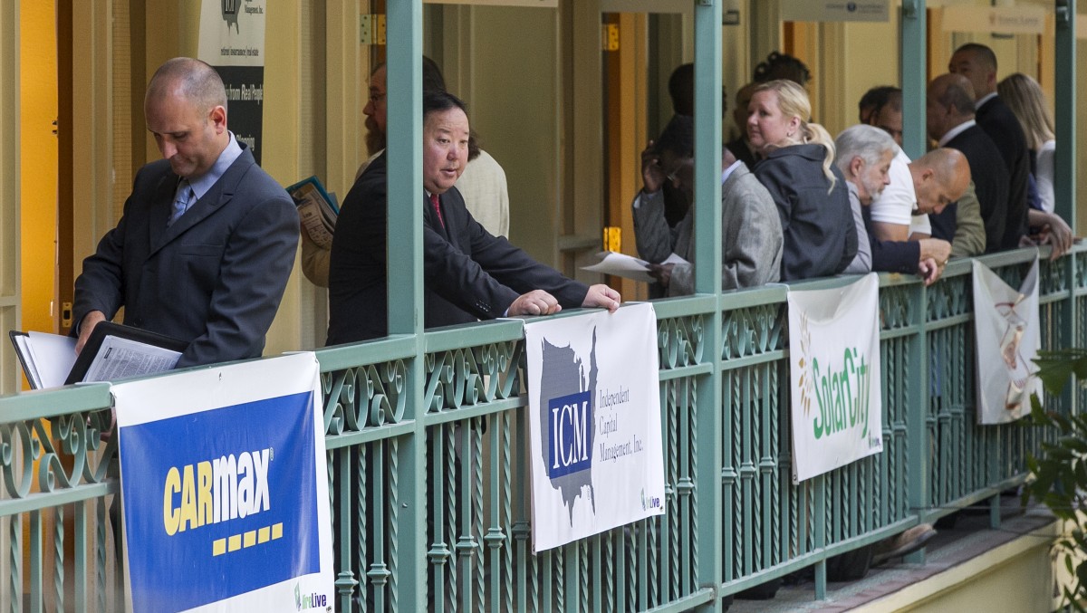 This June 27, 2012 file photo shows job seekers wait for employment interviews at retail and management professionals career fair in El Segundo, Calif. (AP Photo/Damian Dovarganes, File)