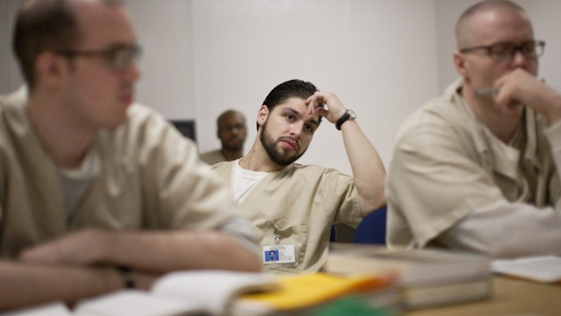 Michael Fauci, middle, Josh Hinman, left Jason Peters, right listen to a lesson during a class at the Cheshire Correctional Institution in Cheshire, Conn., on Thursday, Jan. 28, 2010. (AP Photo/Thomas Cain)