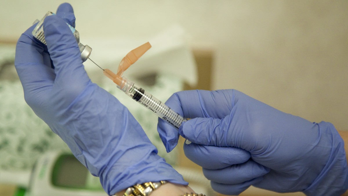 Nurse practitioner Susan Brown prepares a flu vaccination for a customer, Friday, Aug. 27, 2010, in Rockville, Md. (AP Photo/Evan Vucci)