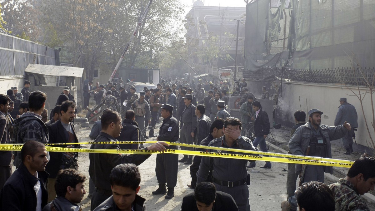 Afghan security men and media members are seen at the scene of a suicide Wednesday, Nov. 21, 2012. (AP Photo/Musadeq Sadeq)