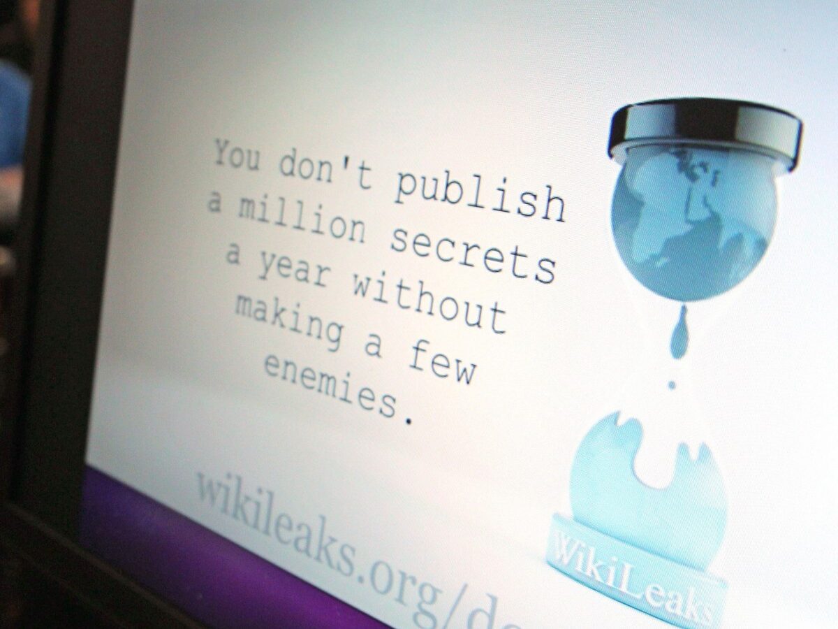 A computer screen shows a WikiLeaks logo, during a live video conference call between WikiLeaks founder Julian Assange and the media, in Brussels, Tuesday, Nov. 27, 2012. (AP Photo/Yves Logghe)