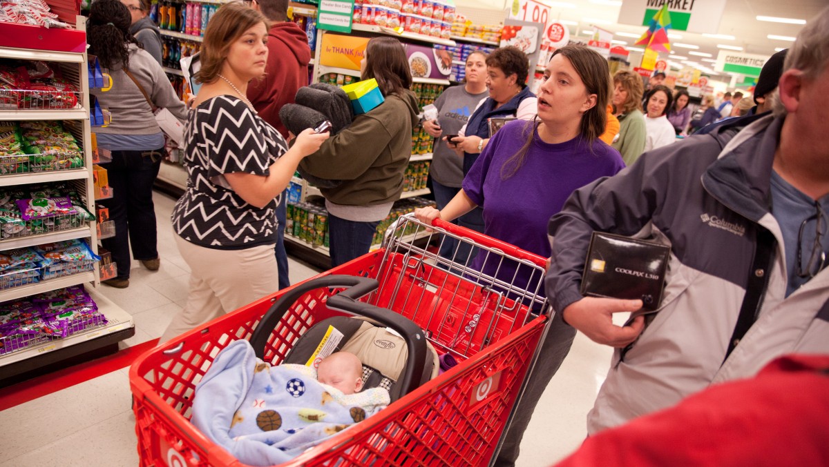 Shoppers attempt to navigate snaking lines and clogged aisles during Target's Black Friday sales event in Flint, Mich. on Thursday, Nov. 22, 2012. (AP Photo/Flint Journal, Griffin Moores)