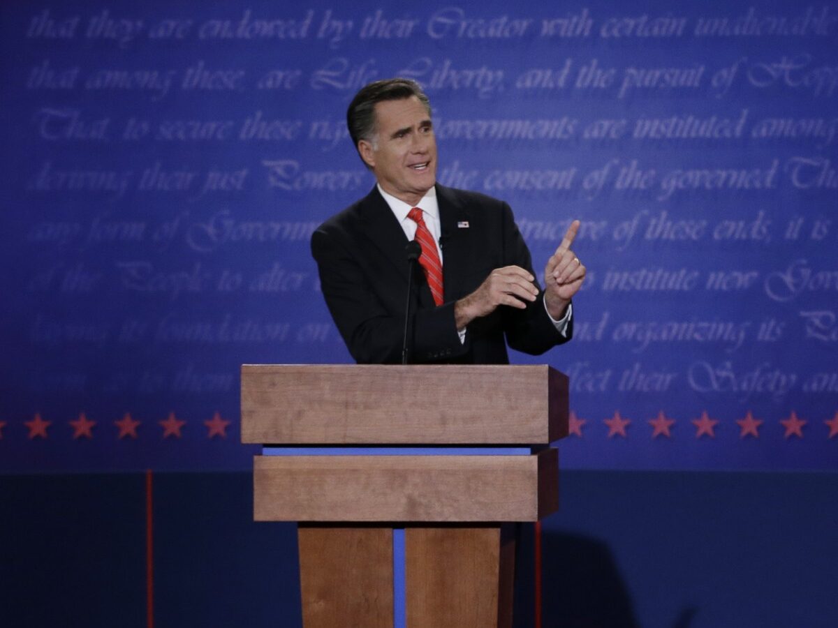 In this Oct. 3, 2012 file photo, Republican presidential nominee Mitt Romney points to President Barack Obama during the first presidential debate at the University of Denver in Denver. (AP Photo/Eric Gay, File)