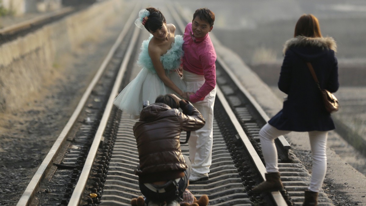 A couple poses for their wedding pictures at the 798 Art District in Beijing, China, Wednesday, Nov. 21, 2012. (AP Photo/Lee Jin-man)
