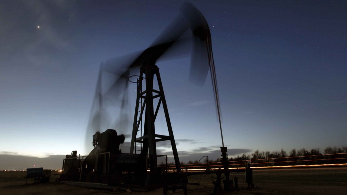 In this Tuesday, March 6, 2012, file photo taken with a long exposure, a pumping unit sucks oil from the ground near Greensburg, Kan. (AP Photo/Charlie Riedel, File)