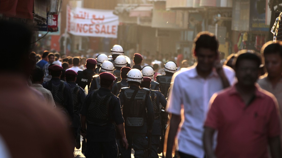 Riot police move through a narrow market street looking for Bahraini anti-government protesters attempting a pro-democracy march in the capital of Manama, Bahrain, on Friday, Oct. 26, 2012. (AP Photo/Hasan Jamali)