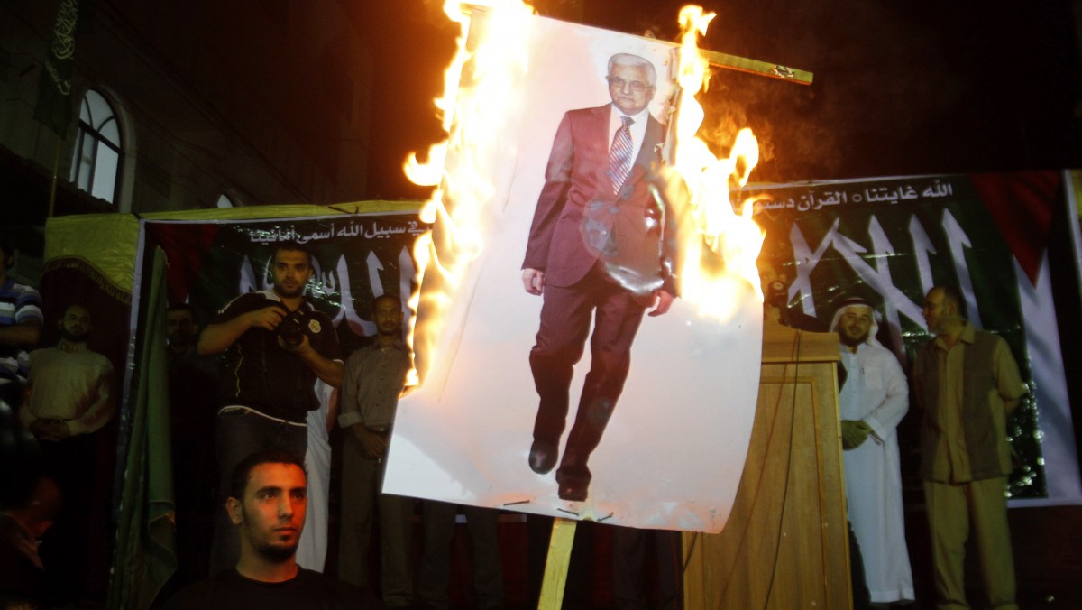 Palestinians march during a protest against president Mahmoud Abbas in the Jabaliya Refugee Camp, northern Gaza Strip Saturday, Nov. 3, 2012. Gazans protested against Abbas' remarks at an Israeli television that suggested millions of Palestinian refugees and their descendants would not be able to return to the places they fled, or were forced to flee, during the fighting surrounding Israel's creation in 1948. (AP Photo/Hatem Moussa)