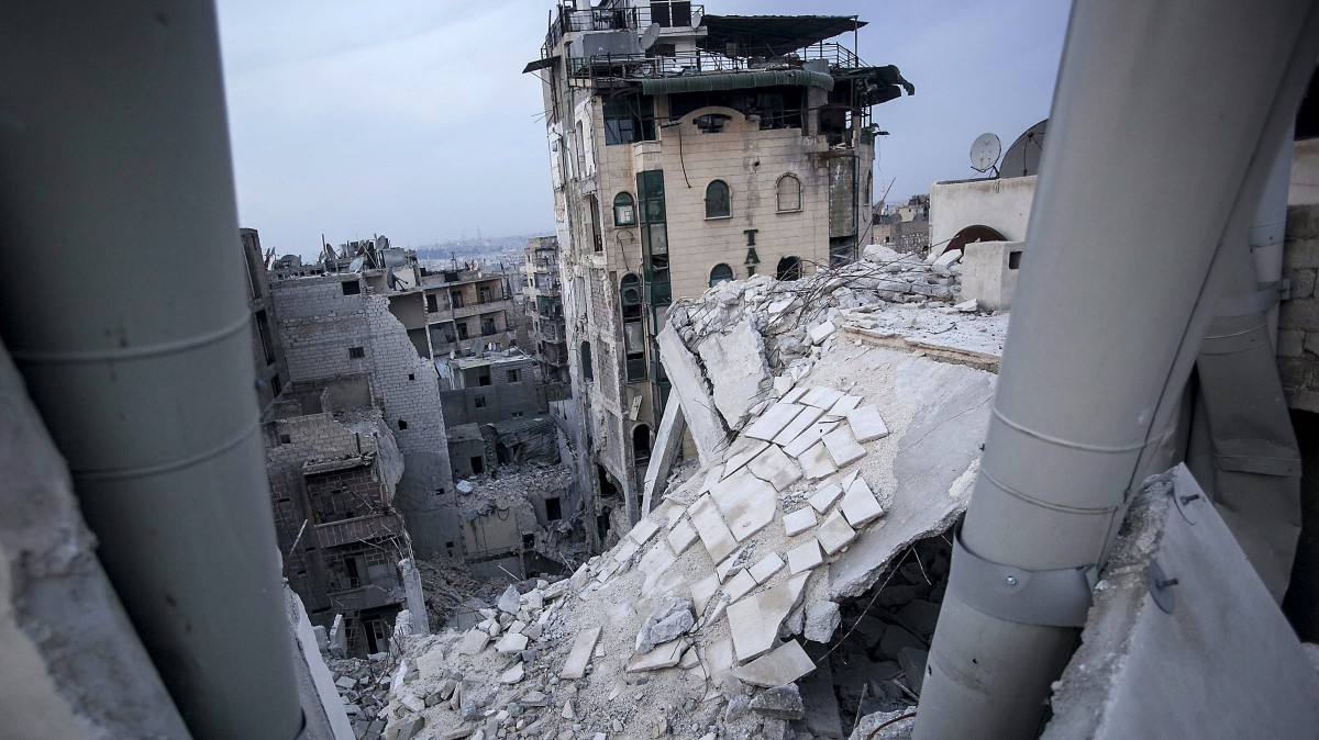 In this Thursday, Nov. 29, 2012 photo, destroyed buildings, including Dar Al-Shifa hospital, bottom, are seen after airstrikes targeted the area last week in Aleppo, Syria. (AP Photo/Narciso Contreras)