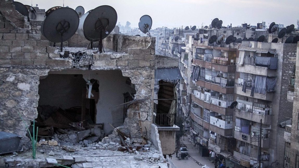 In this Thursday, Nov. 29, 2012 photo, a destroyed building is seen in Aleppo, Syria, after airstrikes targeted the area. (AP Photo/Narciso Contreras)