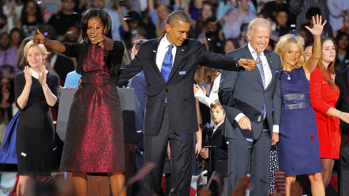 President Barack Obama , joined by his wife Michelle, Vice President Joe Biden and his spouse Jill acknowledge applause after Obama delivered his victory speech to supporters gathered in Chicago early Wednesday Nov. 7 2012. (AP Photo/Jerome Delay)