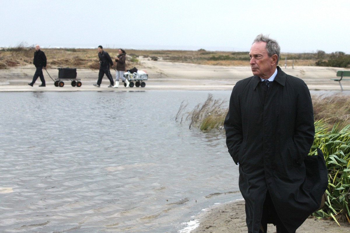 This Oct. 30, 2012 photo provided by New York City Hall shows New York Mayor Michael Bloomberg touring damage from Superstorm Sandy in New York. (AP Photo/New York City Hall, Edward Reed)