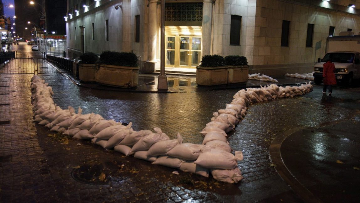 Sandbags protect an entrance of the New York Stock Exchange, Monday, Oct. 29, 2012. (AP Photo/Richard Drew)