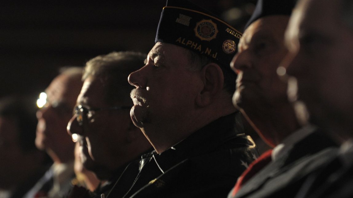 Military Veterans sit a listen to a Veterans Day Tribute ceremony, during which they will receive their high school diplomas that they did not get since they left school to serve in the military at Phillipsburg High School in Phillipsburg, NJ, Sunday, Nov. 11, 2012. (AP Photo/The Express-Times, Matt Smith)