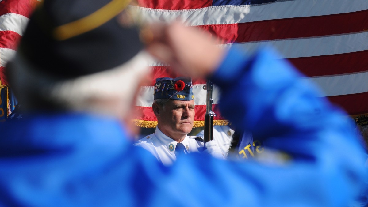 Mike Hoover, pictured, with American Legion Post 568, in Stevensville, Mich., stands at attention Sunday, November 11, 2012, during a Veterans Day Salute held at the Lincoln Township Cemetery, in Stevensville, Mich. (AP Photo/The Herald-Palladium, Don Campbell)