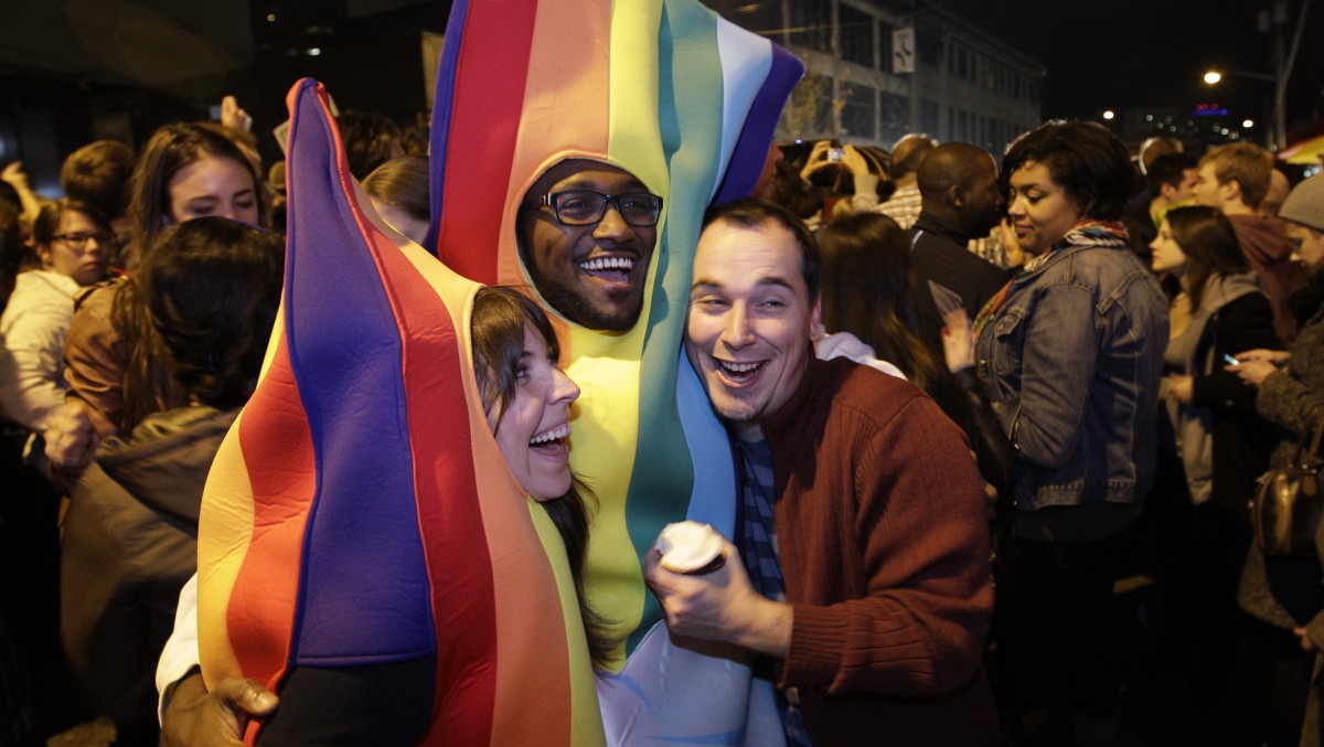 People celebrate early election returns favoring Washington state Referendum 74, which would legalize gay marriage, during a large impromptu street gathering in Seattle's Capitol Hill neighborhood, Tuesday, Nov. 6, 2012. (AP Photo/Ted S. Warren)