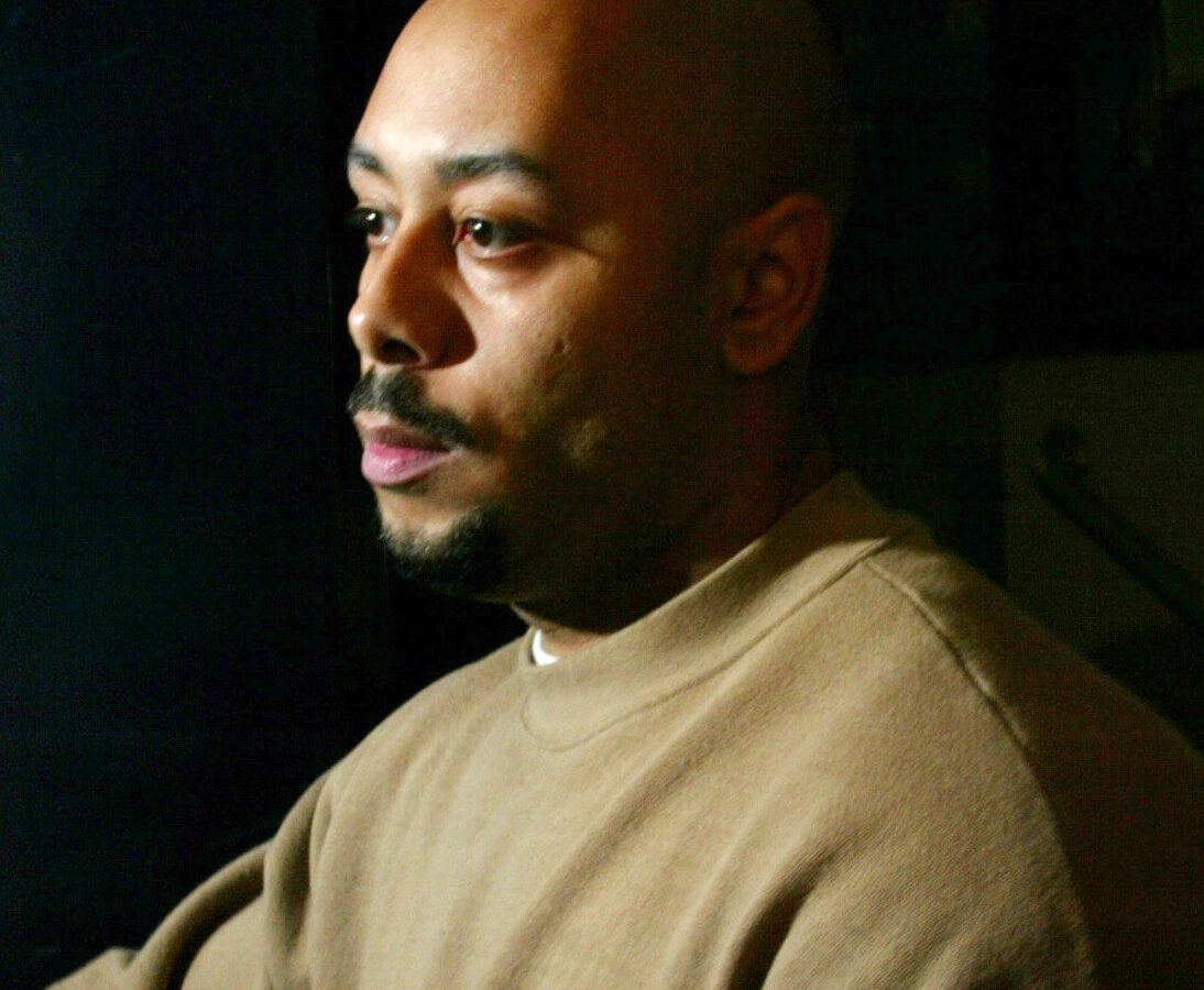 Raymond Santana pushes open a door to leave the Queensboro Correctional Facility Monday, Dec. 23, 2002 in the Queens borough of New York. (AP Photo/John-Marshall Mantel)