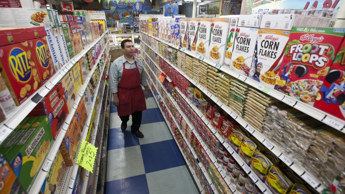 In this photo taken Thursday, Nov. 1, 2012, Grocery market owner Ray Martinez poses for a photo at La Playa Market in Inglewood, Calif. Martinez opposes the passing of California Proposition 37, Mandatory Labeling of Genetically Engineered Food. For every unmarked item at his Inglewood store, Martinez would need to get a sworn statement from suppliers or get independent certification confirming products are GMO-free. (AP Photo/Damian Dovarganes)