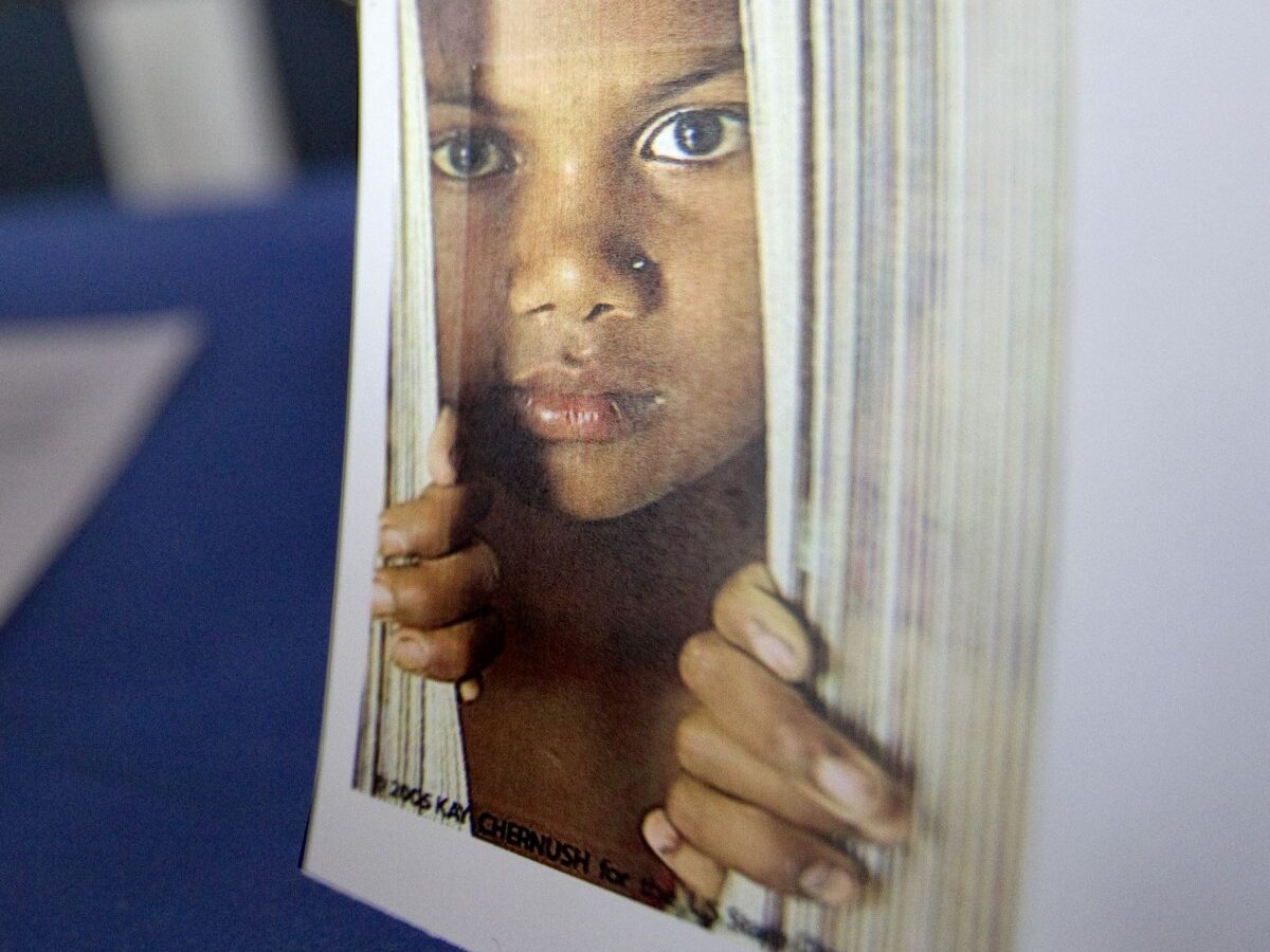 A placard of a child sits on a table during a conference on human sex trafficking Monday, Oct. 31, 2011 in Atlanta. (AP Photo/David Goldman)