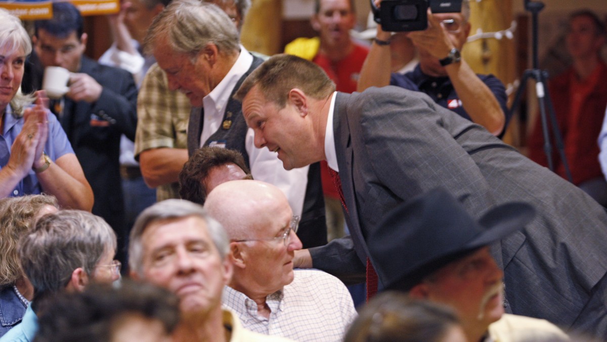 Sen. Jon Tester, D-Mont., works the crowd at the first debate of the 2012 election in Big Sky, Mont. on Saturday, June 16, 2011. (AP Photo/Michael Albans)