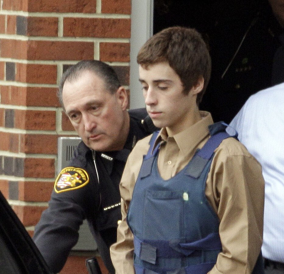 In this Tuesday, Feb. 28, 2012 photo, seventeen-year-old T.J. Lane is led from Juvenile Court by Sheriff's deputies in Chardon, Ohio, after his arraignment in the shooting of five high school students Monday. (AP Photo/Mark Duncan)