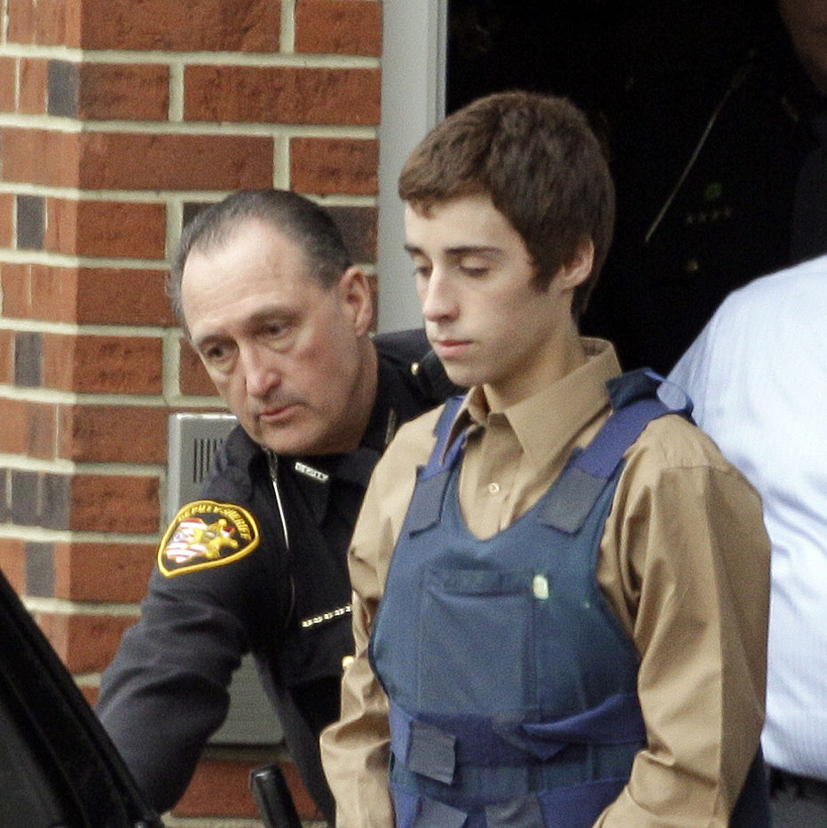 In this Tuesday, Feb. 28, 2012 photo, seventeen-year-old T.J. Lane is led from Juvenile Court by Sheriff's deputies in Chardon, Ohio, after his arraignment in the shooting of five high school students Monday. (AP Photo/Mark Duncan)