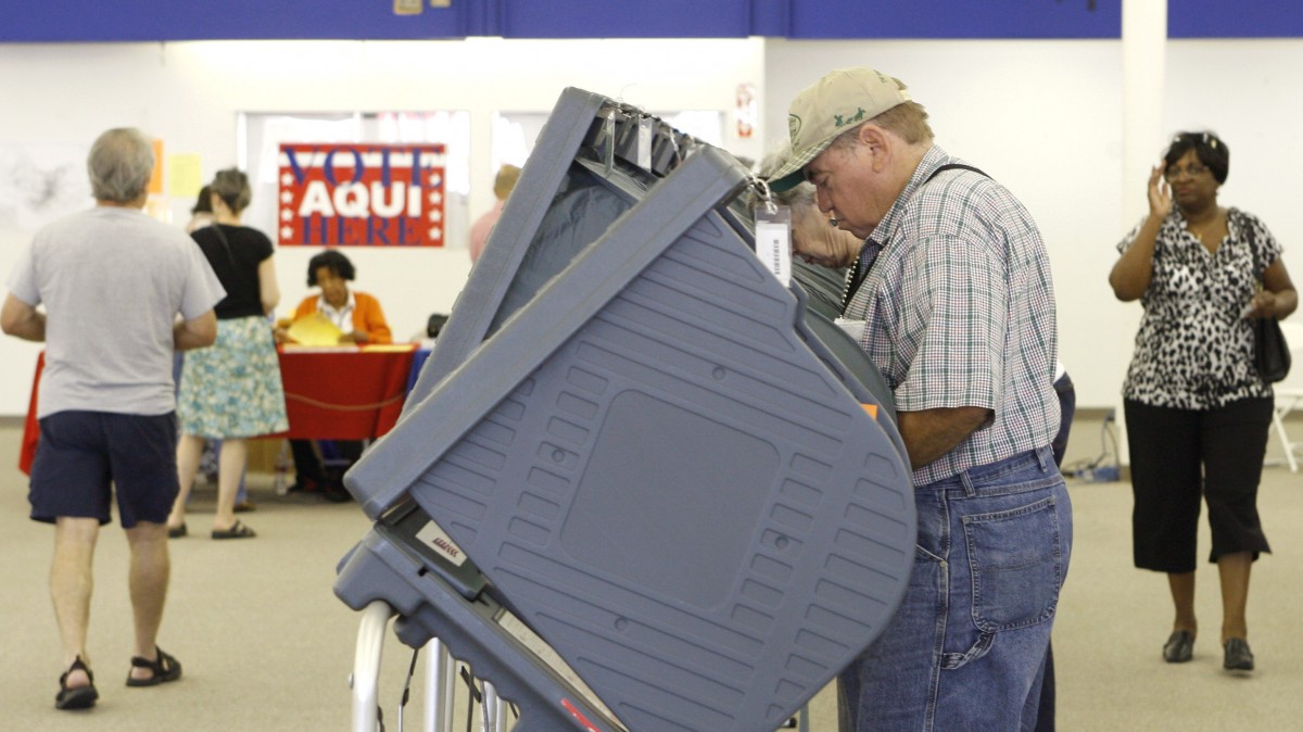 Voters arrive during the first day of early voting at a Travis County mega voting site Monday, Oct. 20, 2008, in Austin, Texas. (AP Photo/Harry Cabluck)