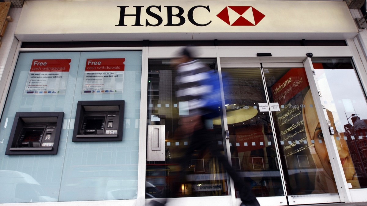 This is a Monday, Feb. 27, 2012 file photo of a pedestrian passes a branch of HSBC bank in London. (AP Photo/Kirsty Wigglesworth, File)