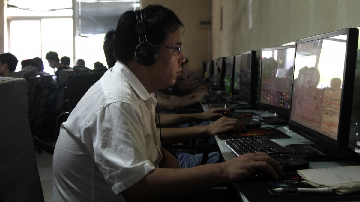 In this photo taken a Chinese man uses a computer at an internet cafe in Beijing, China. (AP Photo/Ng Han Guan)