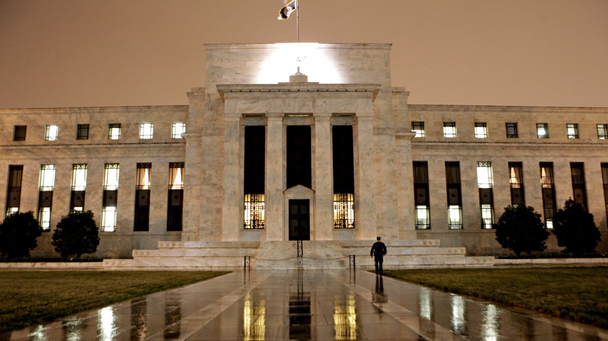 This March 27, 2009, file photo, shows the Federal Reserve Building on Constitution Avenue in Washington. With an eye on the "fiscal cliff," the Federal Reserve is expected to announce a new bond-buying plan to support the U.S. economy on Tuesday, Dec. 11, 2012. (AP Photo/J. Scott Applewhite, File)