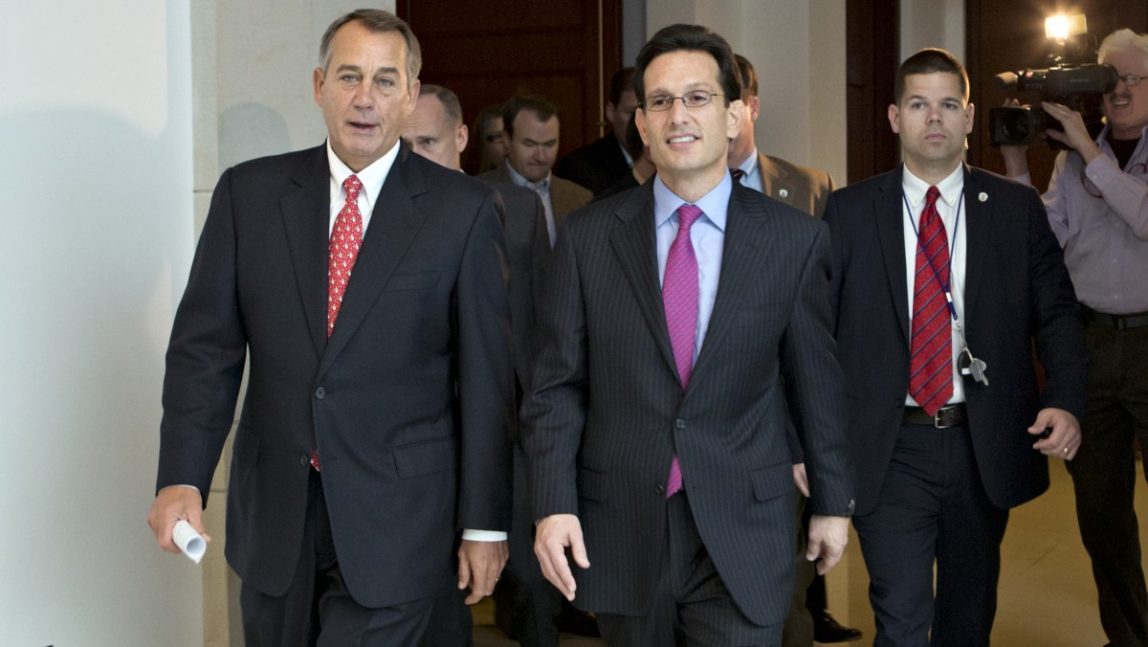 Speaker of the House John Boehner, R-Ohio, left, joined by House Majority Leader Eric Cantor, R-Va., returns to his office after speaking to reporters on the fiscal cliff negotiations, at the Capitol in Washington, Friday, Dec. 21, 2012. (AP Photo/J. Scott Applewhite)