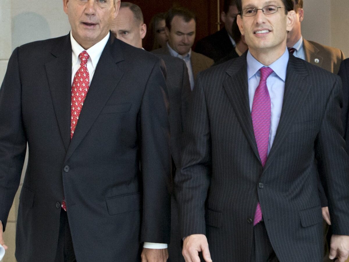 Speaker of the House John Boehner, R-Ohio, left, joined by House Majority Leader Eric Cantor, R-Va., returns to his office after speaking to reporters on the fiscal cliff negotiations, at the Capitol in Washington, Friday, Dec. 21, 2012. (AP Photo/J. Scott Applewhite)