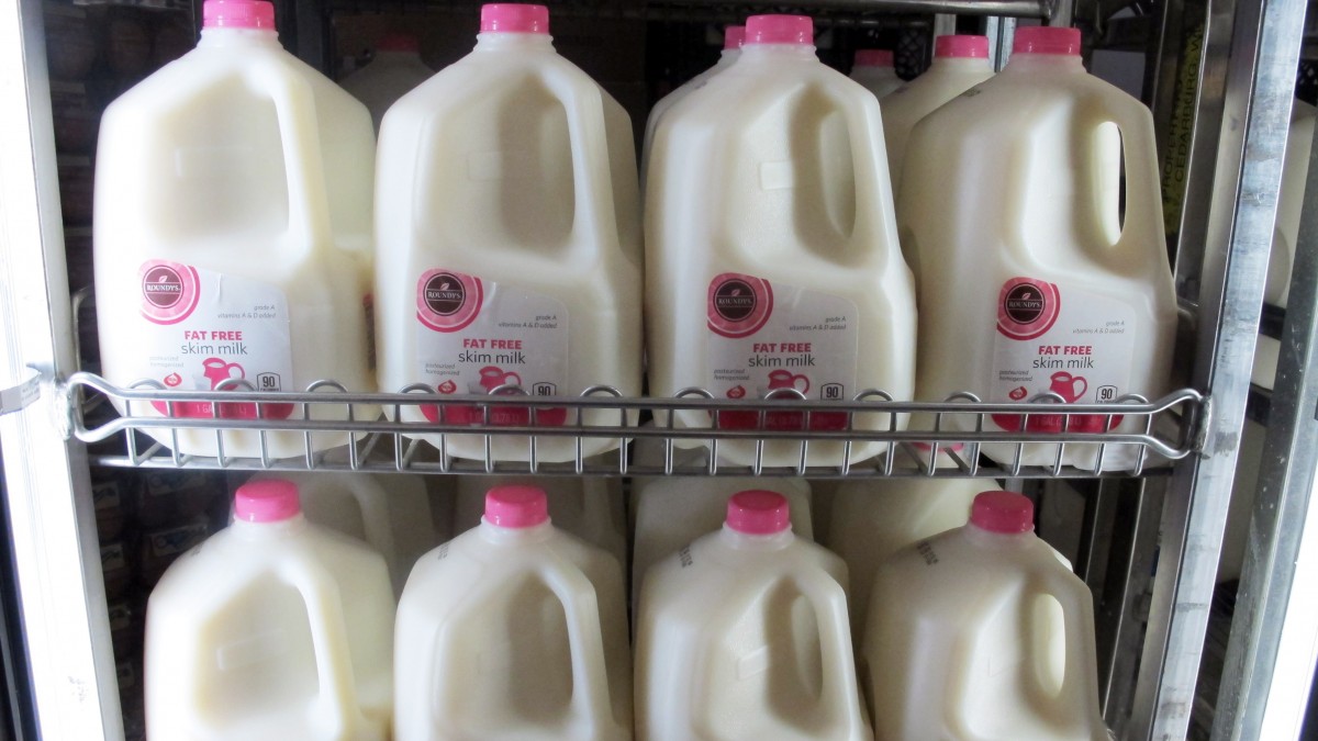 In this Dec. 4, 2012 file photo gallons of milk are arranged at a Milwaukee grocery store. (AP Photo/Dinesh Ramde, File)